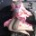 A person wearing a pink floral japanese-style kimono, ideal for role play and cosplay, lies on a black fur rug surrounded by ...