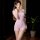 Woman wearing pink mannyqing yoga bodysuit with open-crotch design, slim-fit breathable fabric, short sleeves.