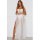 A woman models the muse maxi dress white mesh long gown, featuring a sheer bodice and flowing skirt, perfect for summer fashi...