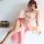 A woman poses elegantly in a sheer chiffon dress inspired by chinese hanfu, featuring a delicate floral design and a flowing ...