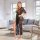 A woman stands confidently in a modern living room, wearing a plus-size lace sleepwear set. the outfit features a deep v-neck...