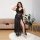 A plus-size model showcases a sexy lace long dress set, featuring a semi-sheer backless design with a transparent evening ens...