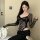 Woman wearing pure & seductive lace bodysuit - style long sleeve sexy matching set, posing elegantly indoors with sheer sle...
