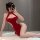 A woman poses in a red lace dress inspired by traditional chinese attire, featuring a high slit and open back design, exuding...