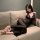 Woman lounging on beige sofa in purple lace deep v sheer mesh sleep dress with bow-tie straps — sexy long nightgown set for w...