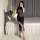 Woman in black sheer bodycon dress with high slit, holding a rose — perfect for nightlife or romantic evenings.