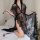 Woman wearing a sexy lace transparent long nightgown set, featuring seductive plus size sleepwear with romantic bedroom linge...