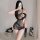 Woman wearing sexy sheer mesh and sequin lingerie dress with contrast panels, featuring a stylish long design for small bust.