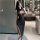 Elegant black bodycon dress with sheer neckline and thigh-high slit, perfect for nightclub wear and special occasions.