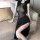 Elegant black bodycon dress with sheer mesh design, featuring a high slit and plunging neckline, perfect for nightclub or spe...