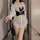 White lace long-sleeve shirt paired with black leather harness, perfect for role play and cosplay outfits.