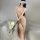 A woman poses elegantly in a sheer, nude-colored nightgown with lace detailing, holding roses. the dress features a flowing d...