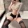 Woman wearing yeyu seductive long-sleeve secretarial lingerie set with bodycon mini skirt and lace thigh-high stockings.