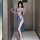 Woman wearing love-ruru sexy lace corset set, featuring off-shoulder mini top and high-slit skirt in shimmering blue.