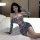 Woman modeling loveruru sexy leopard print bodysuit bikini, tight-fit nightclub lingerie set with long sleeves and cutouts.