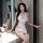 A woman poses in a maid-themed lingerie set featuring sheer fabric and heart accents, perfect for cosplay or playful date nig...