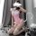 A woman poses in a pink maid costume set featuring a tight-fitting bodice, lace details, fishnet stockings, and an open-crotc...