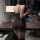 A woman stands by a desk wearing a black manny night purple lace cami sleep dress, featuring flirty ruffled details and lace ...