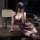 A woman poses in a luxurious setting, wearing a manny night purple lace cami sleep dress. the flirty ruffled babydoll nightgo...