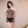 Woman modeling manny night sheer mesh bodysuit set with see-through lace thong and skirt combo in pure temptation style.