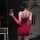 Red lace-up bodycon dress with ruched design, perfect for evening elegance and allure.
