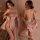 Woman modeling mannyan sensual lace lingerie set with sheer mesh bra top and floral kimono robe, back view shown.