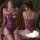 Woman wearing purple lace bodysuit with bow detail, sheer open-crotch design, elegant nightwear for sensual evenings.