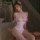 Woman wearing mannyan sexy lace bodysuit - sheer mesh cut-out underwire open-crotch one-piece lingerie in bedroom setting.