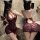 Woman modeling mannyan sexy lace bodysuit with deep v-neck, sheer bodycon skirt, and cutout back in ol secretary style.