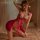 Elegant red lace halter corset dress featuring sheer design, high slit, and mandarin collar, perfect for festive occasions.