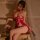 Elegant red lace halter corset dress featuring sheer design, high slit, and mandarin collar, perfect for festive celebrations...