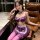 Woman modeling mannyan sexy lace maid costume set with underwire push-up bra, purple lace trim, and matching thigh-highs.