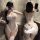 Woman modeling white sheer mesh bunny lingerie with push-up bodysuit, open-crotch design, and fluffy tail.