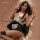 Woman in mannyan sexy maid costume set with split skirt, lace details, and fishnet stockings for role play.