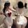 Woman modeling mannyan sexy maid costume set with sheer low-cut top, red bow, thong & detachable skirt for roleplay.