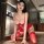 Sexy red sheer lace bodysuit with open-crotch design and low-neck straps, perfect for festive occasions.