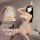 Woman modeling white lace bunny girl bodysuit with ruffled trim, sheer panels, and open-crotch design. includes matching ears...