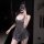 A woman poses in a sleek, dark gray mannyqing daily wear zippered crotchless dress, showcasing its elegant design and sensual...