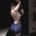Woman in mannyqing lace necktie lingerie set, sheer cross-back bra and panty set, taking a mirror selfie.
