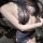 Woman wearing mannyqing lace necktie lingerie set with sheer cross-back bra and panty, showcasing sensual design.