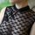 Elegant black lace sheer cheongsam dress featuring floral trim and traditional knot buttons, perfect for classic chinese eleg...