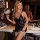 Elegant black satin sleep dress with lace trimmings, featuring a deep v-neckline and backless design, perfect for women seeki...