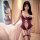 Elegant woman posing in mannyqing lacy bodysuit, featuring sheer cut-out design and criss-cross ties, exuding allure and soph...