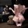 A woman wears a cute pink ruffled maid costume with a sexy design, sitting next to teddy bears. the outfit features a playful...