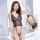 Woman modeling mannyqing pure & sensual sheer bodysuit, a sexy open-crotch lace mesh sleepwear with delicate floral patterns.
