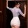 A woman models the mannyqing pure & tempting lingerie set, featuring a sheer lace bodysuit with a fitted skirt, perfect for n...