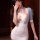 Elegant sheer lace design, revealing bodice with plunging neckline, perfect for nightclub or role play attire.