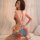 Sexy summer lace backless bodycon mini dress with vibrant abstract print, perfect for elegant yet daring summer looks.