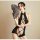 A woman poses elegantly wearing a black lace-trimmed sleepwear set with cutouts, holding a decorative fan. the design feature...