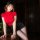 Woman in red top and black skirt posing on wooden table, wearing mannyqing secretarial lingerie set – playful two-way pure & ...